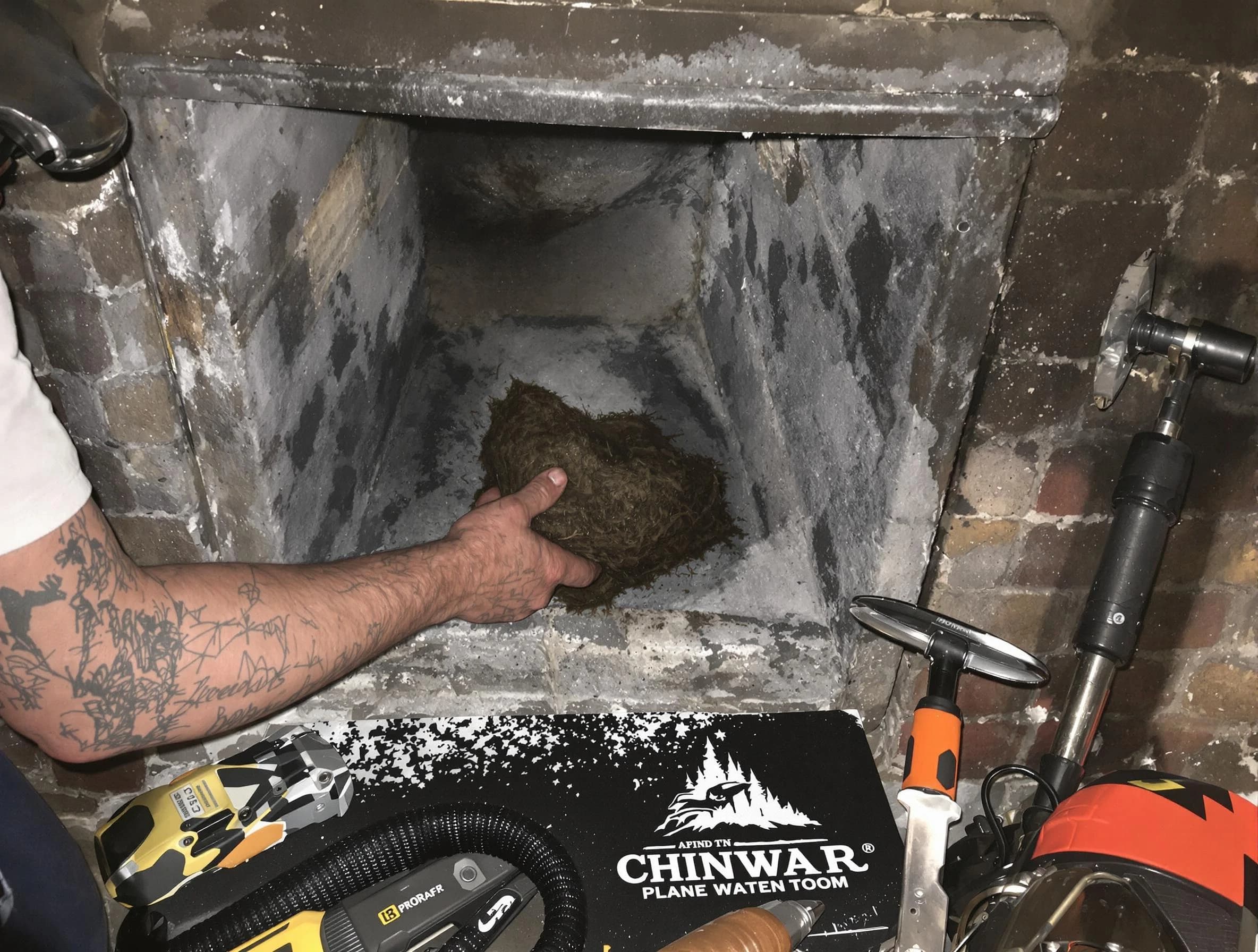 Weymouth Chimney Sweep safely removing debris and screening chimney in Weymouth, MA