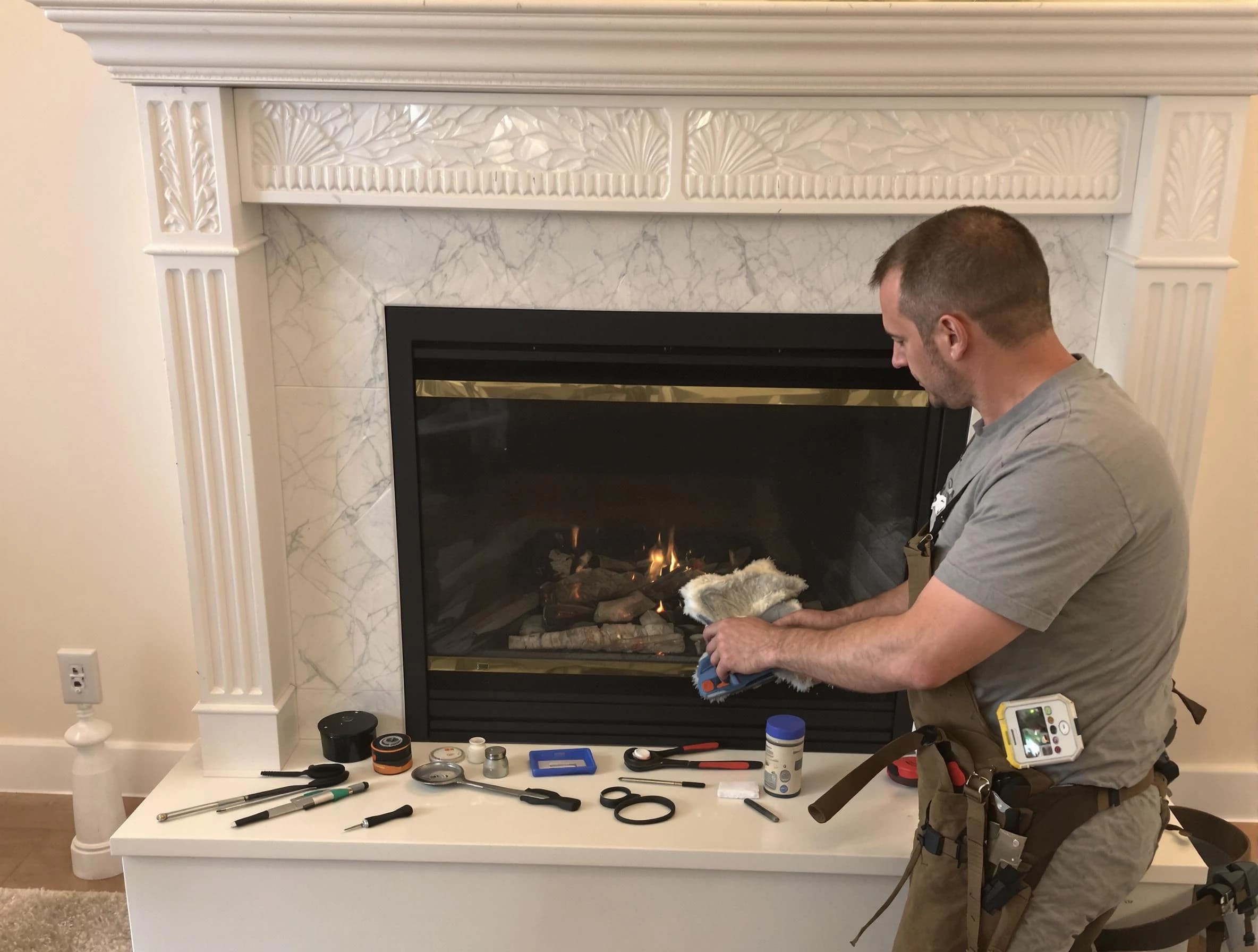 Weymouth Chimney Sweep performing fireplace maintenance in Weymouth, MA